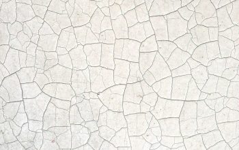 Wallpaper A Close Up of a White Wall with Cracks