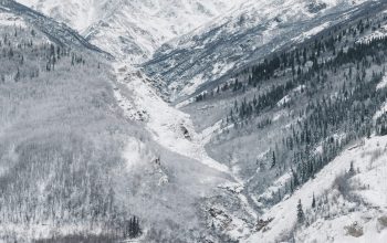 Wallpaper Black Bridge Surrounded by Snow-Covered Mountains