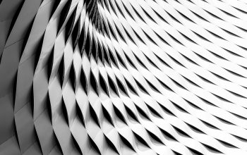 Wallpaper A Curved Facade Covered in White Latticework