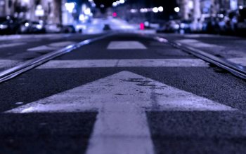 Wallpaper Shallow Focus Road with Forward Arrow