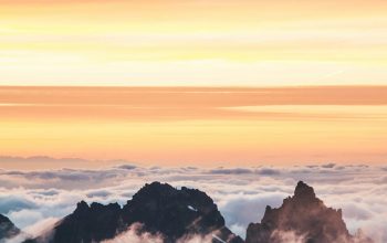 Wallpaper Top View of Mountain Covered by Clouds