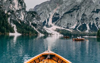 Wallpaper People in a Brown Wooden Boat