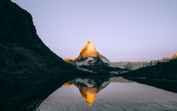 Wallpaper Mountain and Body of Water Under White Clouds During Daytime