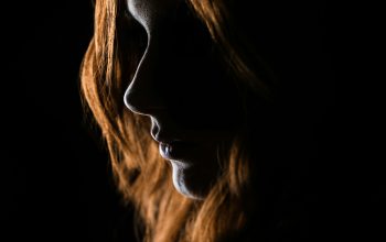 Wallpaper Woman’s Face on Black Background