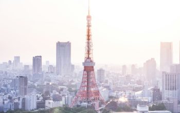Wallpaper Red and White Tower in Urban Cityscape