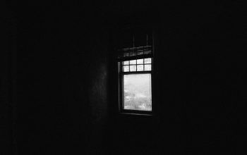 Wallpaper A Window in a Dark Room with a Sky View