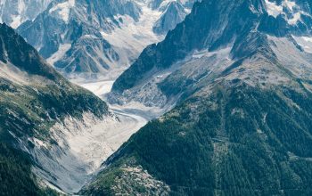Wallpaper Aerial View Photography of Mountains Under Cloudy Sky