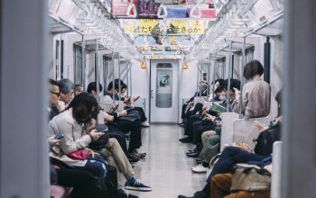 Wallpaper People on Train Looking at Phones