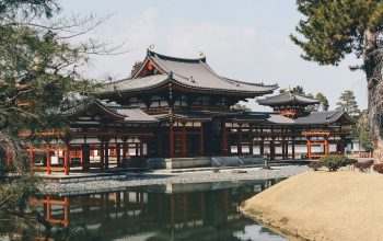 Wallpaper Temple in Front of Calm Body of Water