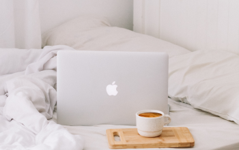 Wallpaper MacBook Beside Teacup with Latte