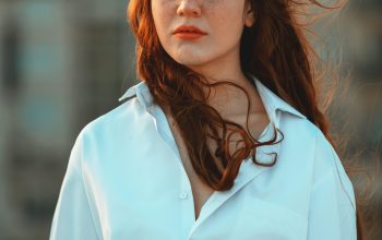 Wallpaper Woman in White Button-Up Long-Sleeved Shirt Smiling