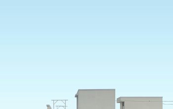 Wallpaper A Tall White Building with a Clock