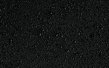 Wallpaper A Black Background with Small Water Bubbles