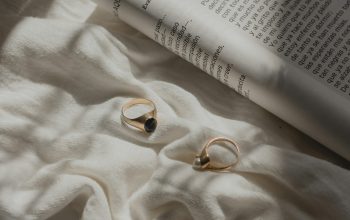Wallpaper Gold-Colored Rings and Open Book