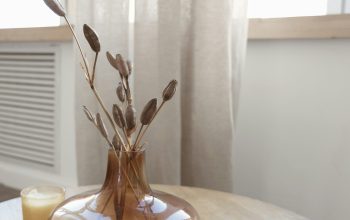 Wallpaper A Table with a Vase and Candle