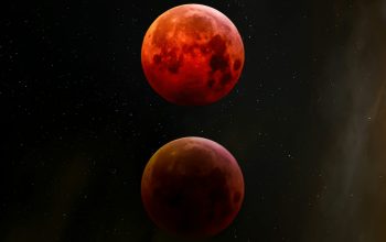 Wallpaper A Group of Red Planets Floating in the Sky