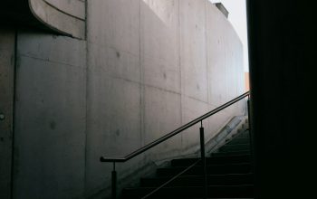 Wallpaper Black Metal Staircase on White Concrete Wall