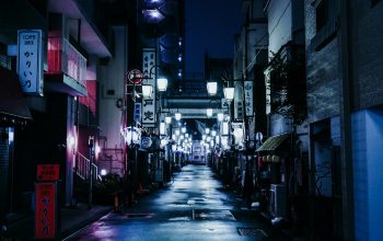 Wallpaper Empty Street with Lighted Lamps at Night