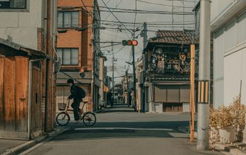 Wallpaper Man in Black Jacket Riding Bicycle on Road During Daytime