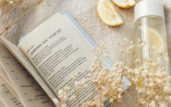 Wallpaper White Book Page with Yellow Flower Petals