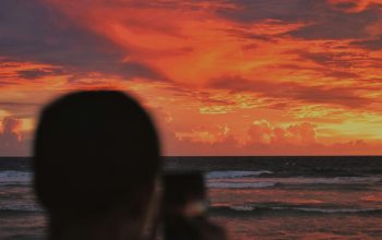 Wallpaper Silhouette of Man Photographing Sunset