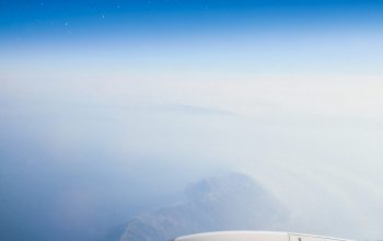 Wallpaper White Airplane Flying Over Mountains