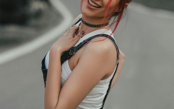 Wallpaper Woman in White Tank Top and Black Denim Shorts Smiling