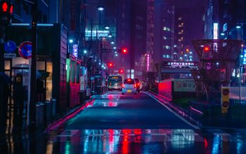 Wallpaper Cars on Road Between High Rise Buildings at Night