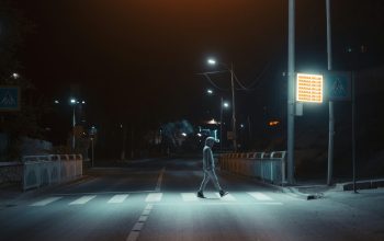 Wallpaper Man in Black Jacket and Blue Denim Jeans Walking on Sidewalk at Night