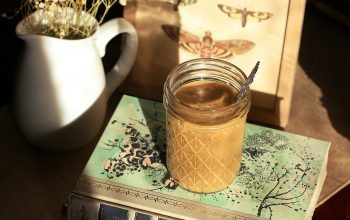 Wallpaper Clear Glass Jar on White and Green Book