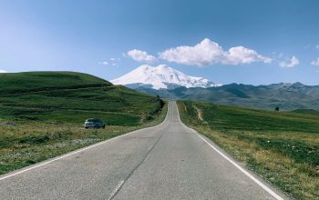 Wallpaper Gray Concrete Road Between Green Grass Field Under Blue Sky