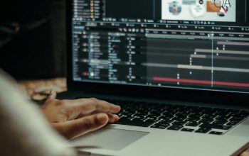 Wallpaper Person Using MacBook Pro on Table