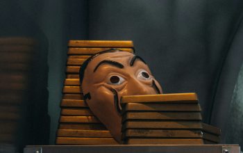 Wallpaper A Wooden Mask on a Shelf