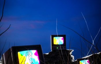 Wallpaper Three Televisions on Grass