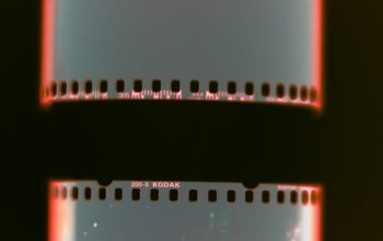 Wallpaper A Close Up of a Film Strip on a Black Background