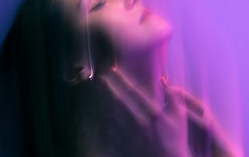 Wallpaper A Woman with Eyes Closed, Purple Background