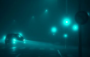 Wallpaper A Car Driving at Night