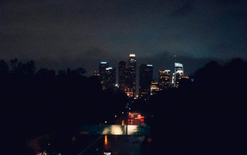 Wallpaper A Night Time View of a City Skyline
