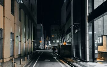 Wallpaper An Empty Street at Night with a Train on the Tracks