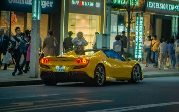 Wallpaper A Yellow Sports Car at Night