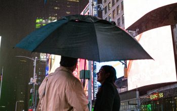 Wallpaper A Couple Under an Umbrella