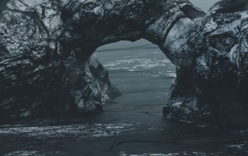 Wallpaper A Black and White Ocean Rock Photo