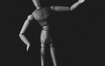 Wallpaper A Black and White Wooden Figure