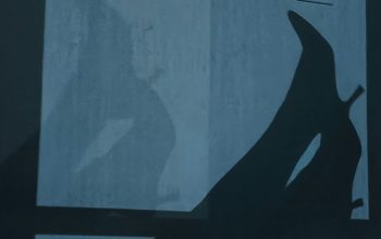 Wallpaper A Shadow of a Person Laying on a Bed