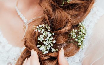 Wallpaper Woman Holding Hair with Flower
