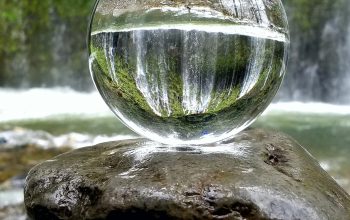 Wallpaper Clear Glass Ball on Brown Rock