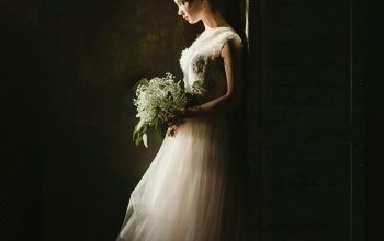 Wallpaper Woman in White Wedding Gown Holding Bouquet