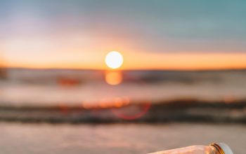 Wallpaper Clear Glass Mason Jar on Beach During Sunset
