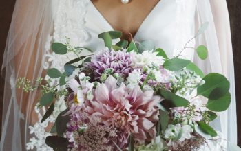 Wallpaper Bride Holding a Bouquet of Flowers