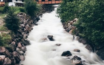 Wallpaper Time Lapse Photography of Stream Near Houses